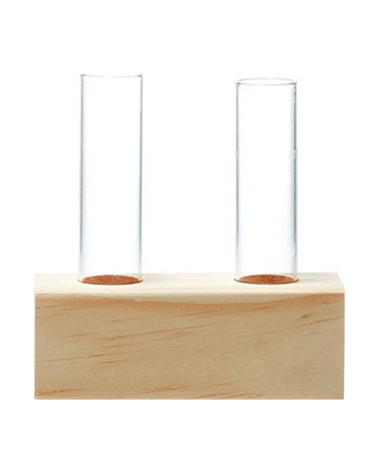 Wooden block with two glass test tubes and a single slanted wooden frame with one tube, on white