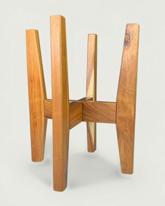Adjustable plant stand in solid acacia wood with splayed square legs, on a studio background