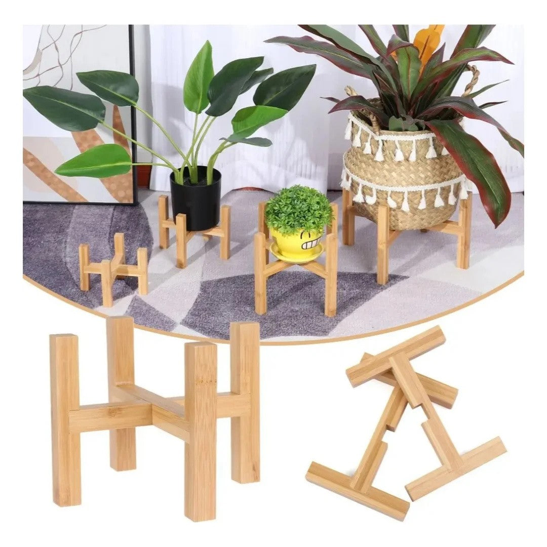 Three bamboo plant stands in different sizes with potted plants in a living room