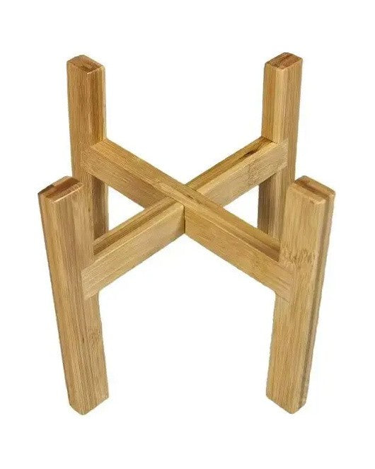 Low bamboo plant stand with four legs and a cross base, on white