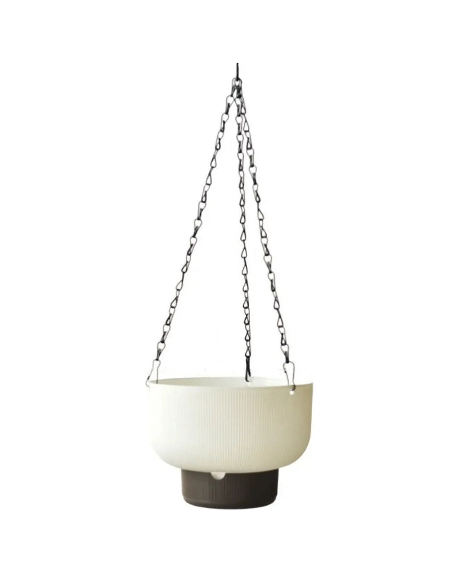 White hanging planter with a dark water base and a black chain, on white